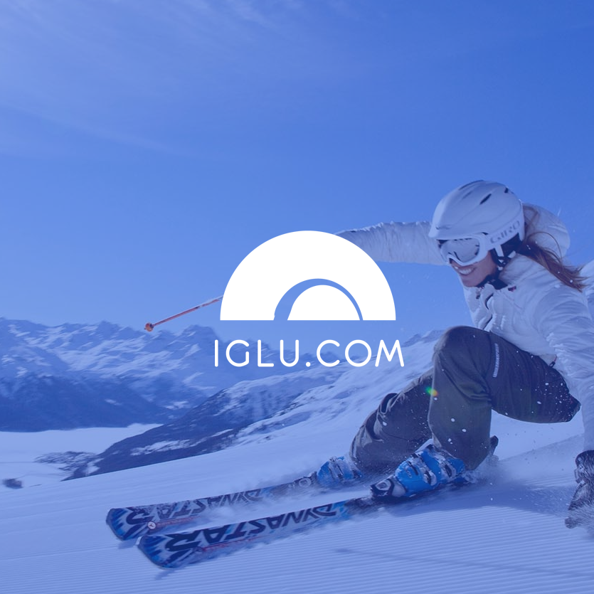 Iglu logo and woman skiing